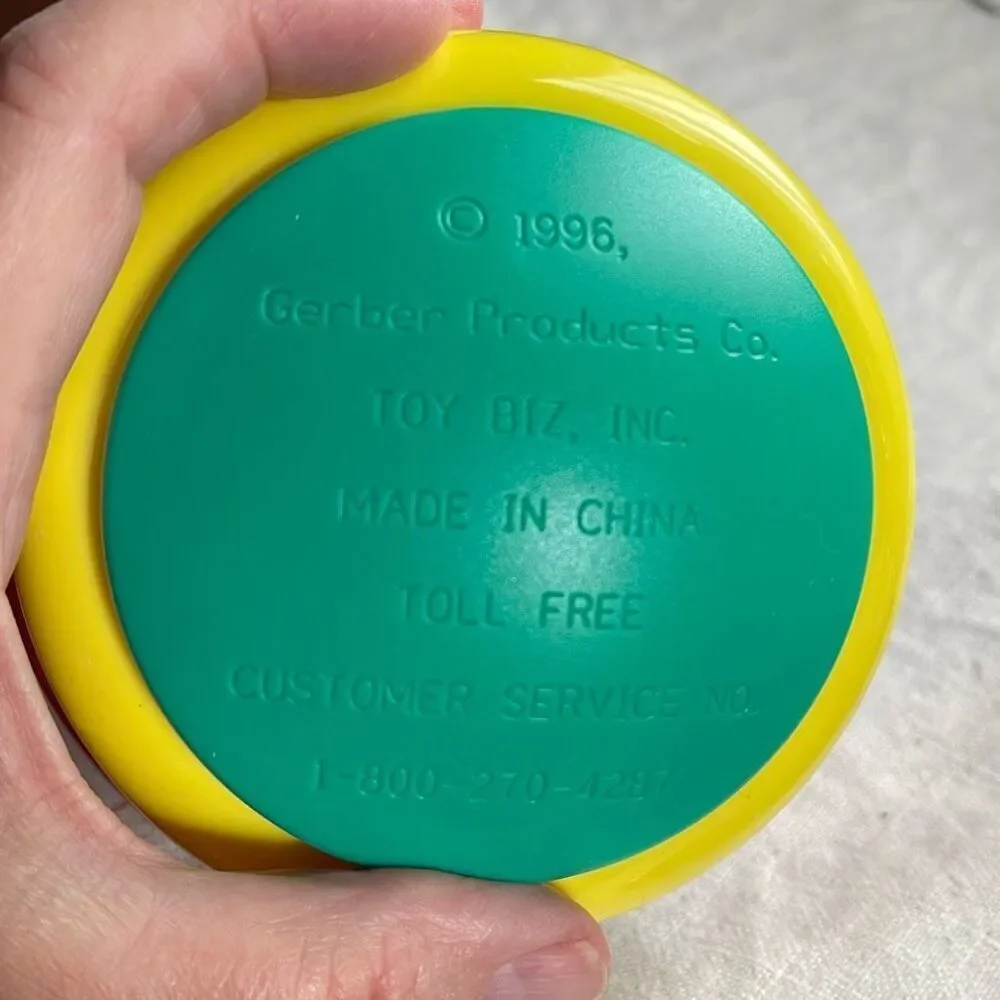 1996, Ring ‘n Roll Gerber Products Co. Toy Biz, Inc roundish rolling rattle infa